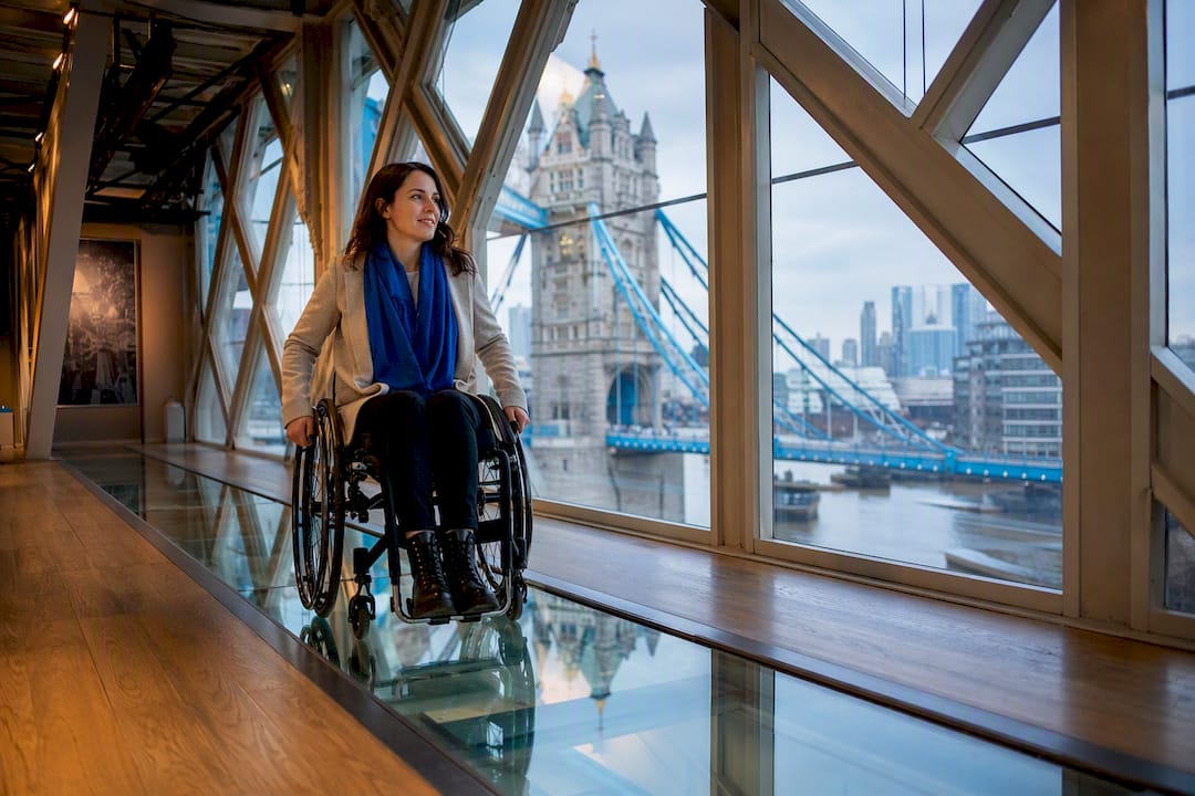 Wheelchair user on Tower Bridge glass walkway