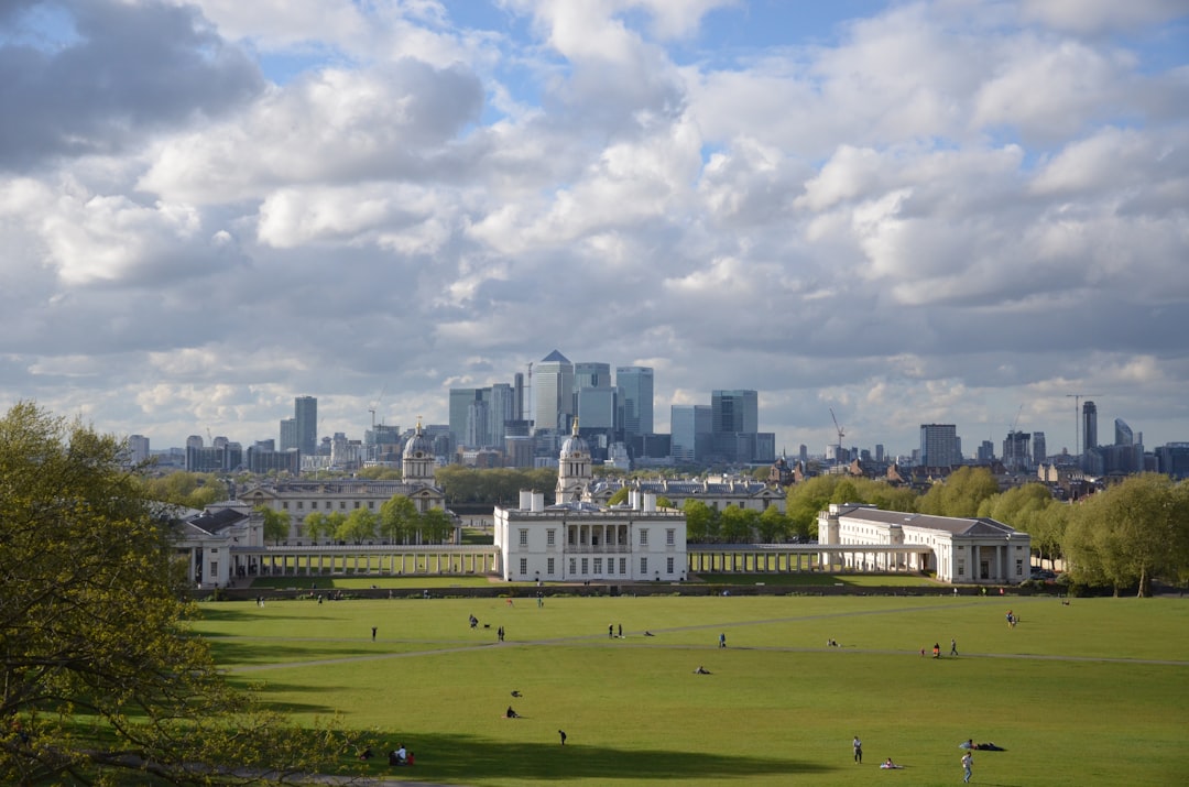 Royal Observatory Greenwich on the hill with London skyline and Canary Wharf behind